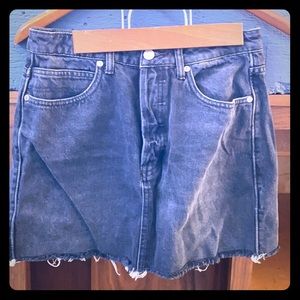 Black jean skirt. Raw hem